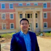 Picture of Daniel Ferreira da Silva in front of Gilbert Hall, Department of Romance Languages at the University of Georgia